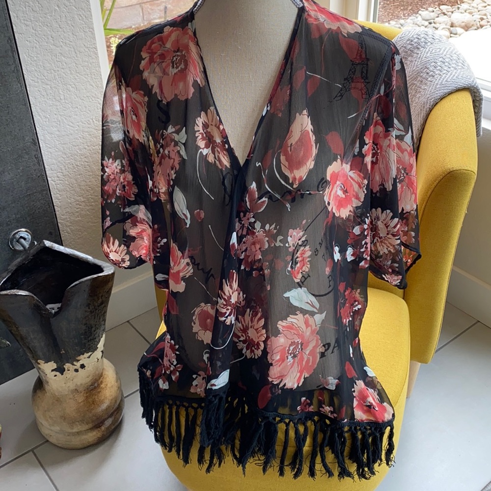 Cute sheer jacket with long fringed hemline